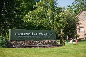 WWU Campus sign with grass and trees